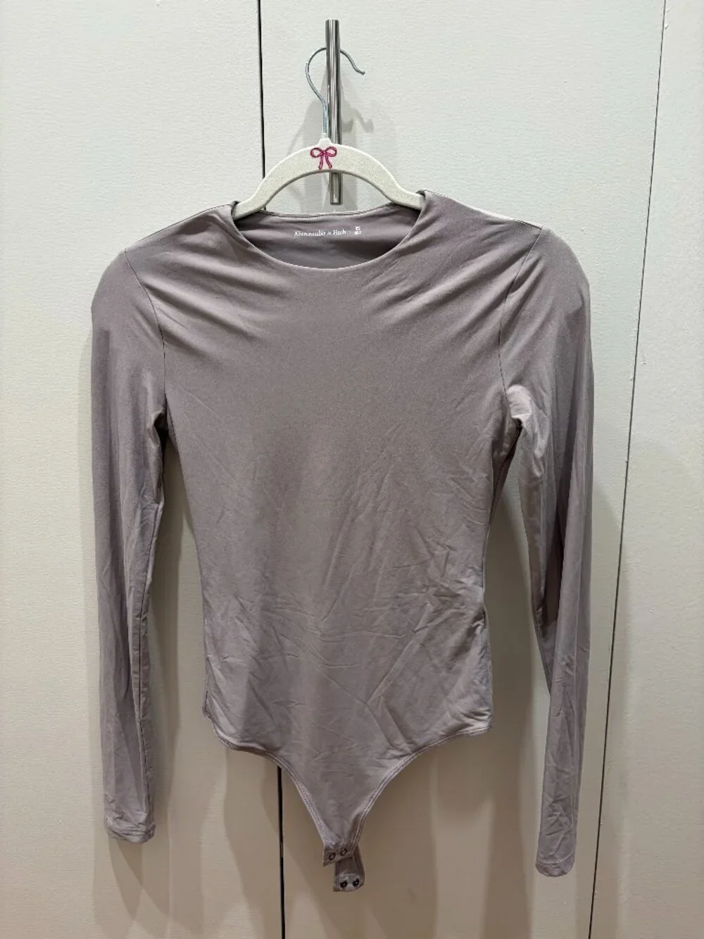 Abercrombie long-sleeved body suit. Light mauve, size XS